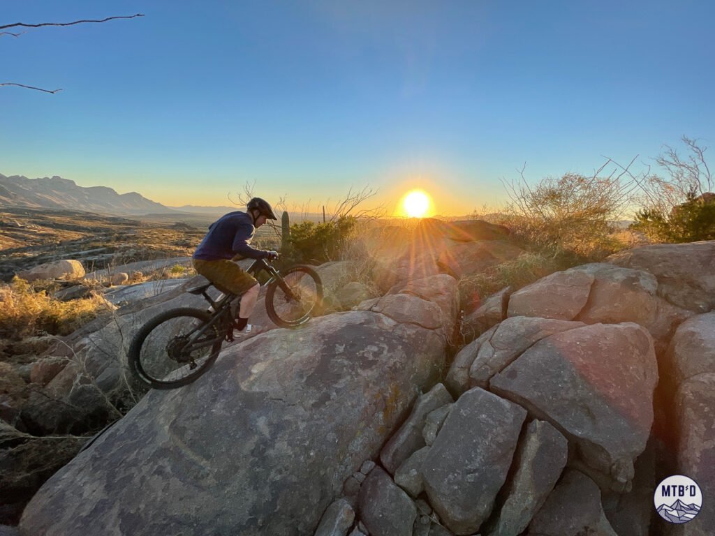 Mountain biker on slickrock at sunset, Cowboy Slickrock trail, Golder Ranch, Tucson Arizona