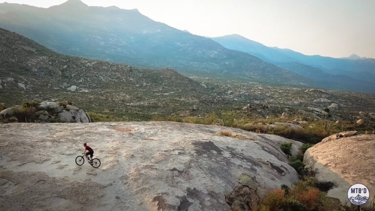 Aerial view of mountain biker riding exposed slickrock on Cowboy Slickrock trail at Golder Ranch, Tucson Arizona